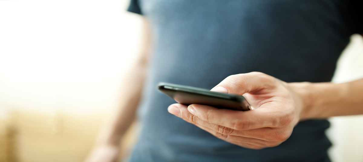man holding a mobile phone man holding a mobile phone